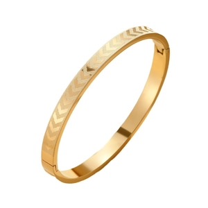 Polished gold stainless steel bangle featuring geometric arrow patterns and a secure clasp