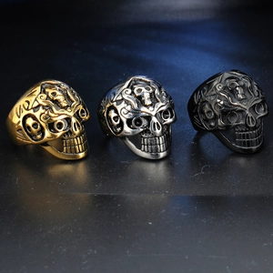 Three men's vintage gothic skull rings in gold, silver, and black titanium steel