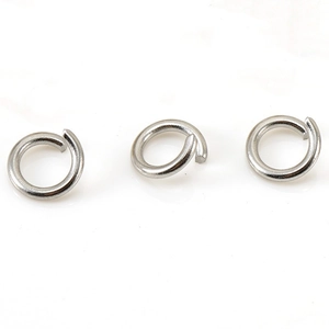Macro shot of three silver 18K plated stainless steel jump rings for DIY jewelry making