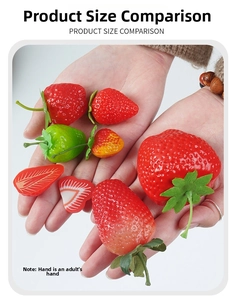Detailed size comparison of realistic artificial strawberry models in human hand