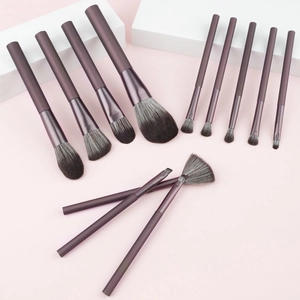 Professional 13-piece makeup brush set with dark brown matte handles and soft grey bristles