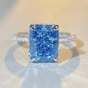 Luxurious S925 silver ring featuring a radiant cut blue zircon and pavé set diamonds