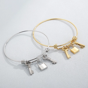 Adjustable stainless steel lock and key pendant bangle set in gold and silver finish