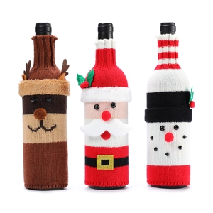 Three-piece set of knitted Christmas wine bottle covers featuring Santa, reindeer and snowman