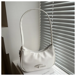 Detailed shot of white crescent shoulder bag with metallic accent and smooth PU leather texture
