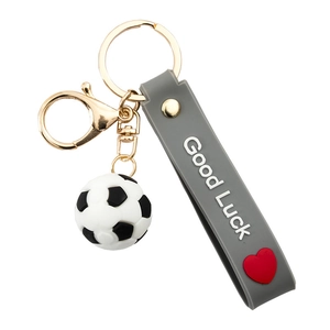 3D football keychain with Good Luck strap and heart charm on white background