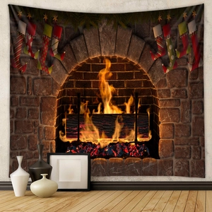 Detail of Christmas fireplace tapestry with burning logs and festive socks on wall