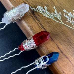 Macro view of crystal U-shaped hair pins with wire-wrapped quartz in various colors