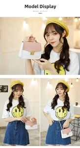 Detail view of pink and white color-block crossbody bag with elegant gold metal square buckle