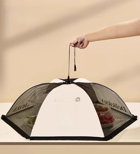 Detail of a foldable mesh food cover with Heureux print and top pull-up rope