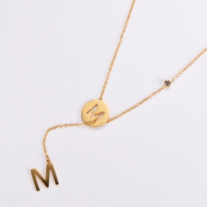 Double M letter pendant necklace in 18K gold titanium steel with small zircon accent