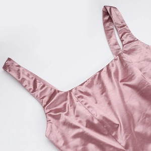 Close-up of the square neckline and smooth satin fabric detail on the pink evening dress