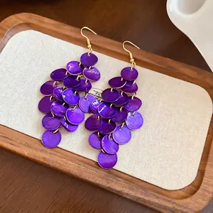 Long multilayer drop earrings with purple iridescent shells and gold metal hooks