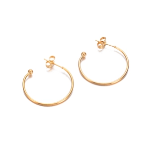 Polished golden stainless steel C-shape earring hoops on a clean white background