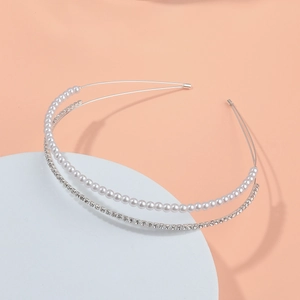 Detail of double-layer silver headband featuring elegant pearls and sparkling rhinestones