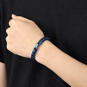 Close-up of deep blue titanium steel dragon bone chain bracelet with mechanical clasp on wrist