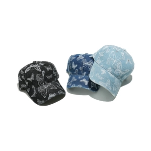 Three butterfly-embroidered denim baseball caps in black, dark blue, and light blue colors