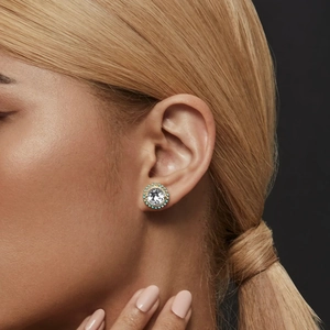 Close-up of luxury S925 silver round stud earring with turquoise and diamond inlay