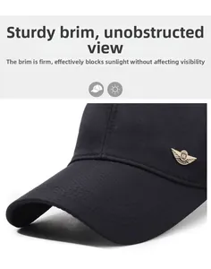 Detail of black baseball cap with metallic M logo and curved sunshade brim texture