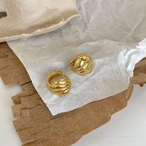 925 silver chunky gold hoop earrings with mixed textures on textured paper