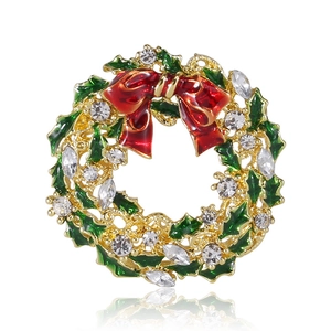Sparkling Christmas wreath brooch with red bow and green enamel on golden base