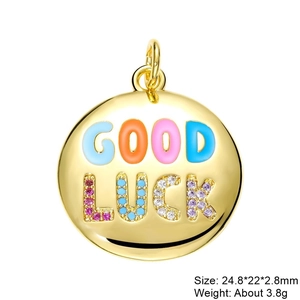Macro detail of Good Luck round gold charm with colorful enamel and zircon inlay