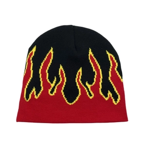 Hip-hop style knitted beanie featuring a black base and vibrant red flame pattern