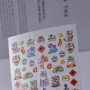 Macro view of 3D embossed 5D nail art stickers with traditional Chinese lion dance patterns