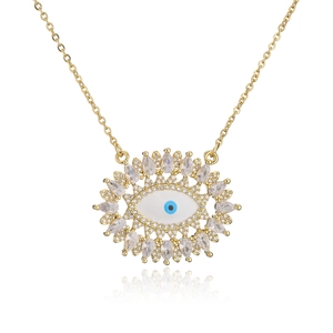 Detailed close-up of 18K gold plated evil eye pendant with sparkling cubic zirconia crystals