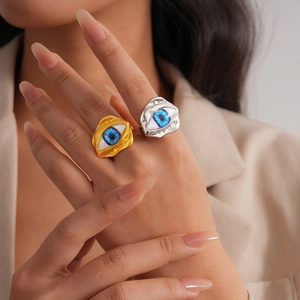 Irregular resin Evil Eye open rings in gold and silver finish worn by a model