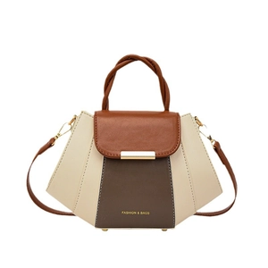 Contrast color structured satchel bag with woven handle and gold hardware on white background