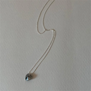 Minimalist 925 sterling silver necklace with a heart-shaped dark grey crystal pendant