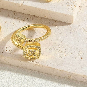 Macro shot of 14K gold plated ring featuring a large square face set with zircon stones