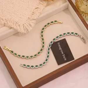 Macro detail of emerald green zircon bracelets in gold and silver micro-set finishes