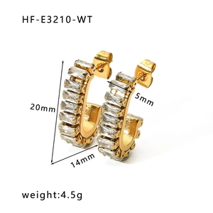 Detail view of 18K gold earrings with square zircon stones and precise dimensions