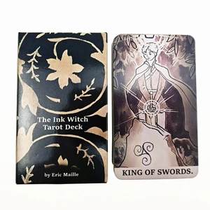 Detail of the Ink Witch Tarot King of Swords card with elegant black and gold oracle box