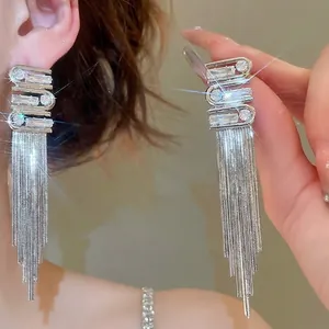 Silver long tassel earrings with sparkling zircon stones and luxurious geometric S-shape design