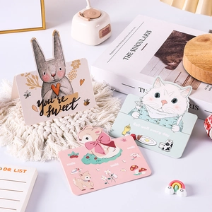 Three cute cartoon animal greeting cards with bunny, cat, and deer motifs on a white mat
