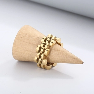 Detail of a gold stainless steel ring with a five-link jubilee watch band design