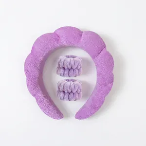 Detail view of purple plush sponge headband and matching absorbent wristbands for face washing
