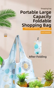 Detail of light blue foldable 190T polyester shopping bag with geometric sun pattern