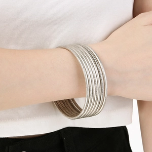 Detailed view of 3mm stacked minimalist stainless steel bangles with frosted matte finish