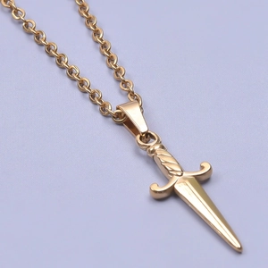 Detailed close-up of a 18k gold plated stainless steel sword pendant with a classic link chain