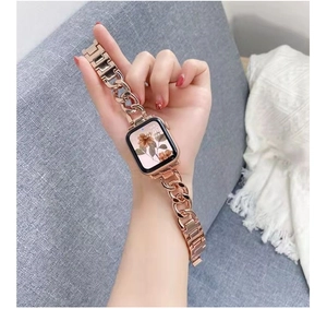 Detail of rose gold metal chain watch band with H-shaped clasp for smartwatches
