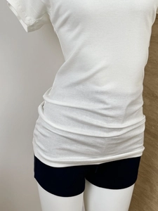 Detail view of white Tencel wool blend T-shirt with elegant deep V-neck and slim fit design