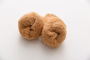 Detail of light brown coral fleece socks showing soft plush texture and thick material