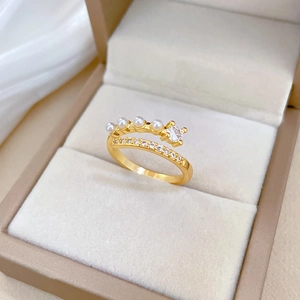 Elegant gold double layer open ring featuring white pearls and sparkling cubic zirconia