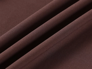 Macro view of high-elasticity dark brown fabric showing close-up fiber texture