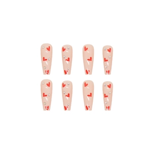 Unghie finte lunghe rosa nude con motivi a cuore rosso e strass luccicanti