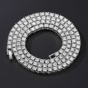 Detailed macro view of silver tennis chain with brilliant stones and secure clasp closure